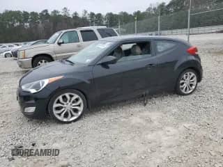 2012 Hyundai Veloster w/Red Int z VIN KMHTC6AD2CU058130, wystawiony jako Copart lot #86747414 z przebiegiem 162 982 mil mil oraz Czysty tytuł • Clean title. Historia ofert i sprzedaży dostępna na DreamBid. Obrazek 1.