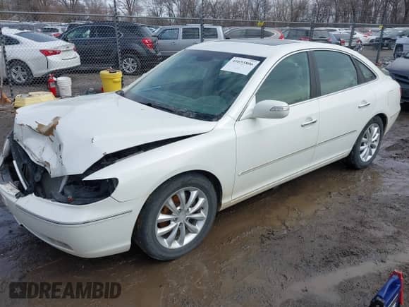 2007 Hyundai Azera SE z VIN KMHFC46F57A178118, wystawiony jako IAAI lot #41653806 z przebiegiem 104 221 mil mil oraz . Historia ofert i sprzedaży dostępna na DreamBid. Obrazek 2.