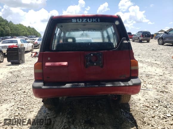 ✅ 1991 Suzuki Sidekick • VIN: JS3TD01V3M4100654 • Lot: 64606705. Listed on Copart with 51,446 mi. Free auction sales archive from the USA and detailed vehicle history report at DreamBid. Image 6.
