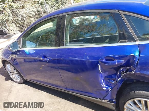 ✅ 2015 Ford Focus Titanium • VIN: 1FADP3J24FL228210 • Лот: 43499726. Опубликован ранее на IAAI с пробегом 121 672 миль. Бесплатный доступ к архиву аукционных продаж из США и подробный отчёт об истории автомобиля на DreamBid. Изображение 14.