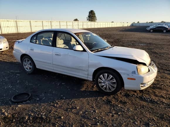 2004 Hyundai Elantra GLS z VIN KMHDN46D54U795500, wystawiony jako Copart lot #79738314 z przebiegiem 119 167 mil mil oraz Szkoda całkowita • Salvage title. Historia ofert i sprzedaży dostępna na DreamBid. Obrazek 4.