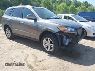 ✅ 2011 Hyundai Santa Fe SE • VIN: 5XYZHDAG3BG055610 • Lot: 42568292. Listed on IAAI with 129,015 mi. Free auction sales archive from the USA and detailed vehicle history report at DreamBid. Image 1.