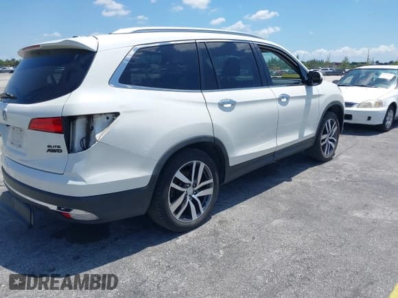 ✅ 2018 Honda Pilot Elite • VIN: 5FNYF6H00JB058623 • Lot: 42323415. Listed on IAAI with 102,015 mi. Free auction sales archive from the USA and detailed vehicle history report at DreamBid. Image 4.