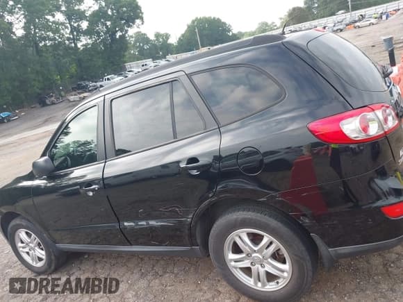 ✅ 2012 Hyundai Santa Fe GLS • VIN: 5XYZGDAG2CG144556 • Lot: 42596221. Listed on IAAI with 164,813 mi. Free auction sales archive from the USA and detailed vehicle history report at DreamBid. Image 14.