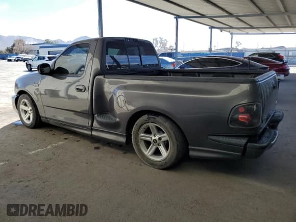 ✅ 2003 Ford F-150 Lightning • VIN: 2FTRF07313CA52692 • Lot: 44399975. Listed on Copart with 78,773 mi. Free auction sales archive from the USA and detailed vehicle history report at DreamBid. Image 2.