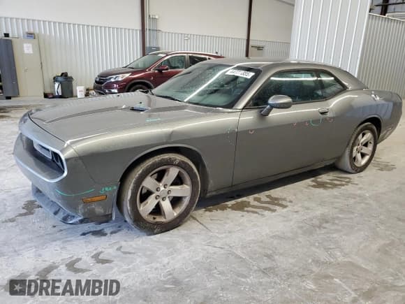 ✅ 2012 Dodge Challenger SXT • VIN: 2C3CDYAG1CH174885 • Lot: 44727385. Wystawiony na Copart z przebiegiem 219 845 mil. Bezpłatny archiwum sprzedaży aukcyjnych z USA i szczegółowy raport historii pojazdu na DreamBid. Zdjęcie 1.