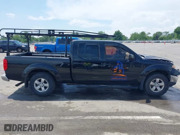 ✅ 2009 Nissan Frontier SE • VIN: 1N6AD09W69C409466 • Lot: 42757199. Listed on IAAI with 150,758 mi. Free auction sales archive from the USA and detailed vehicle history report at DreamBid. Image 14.