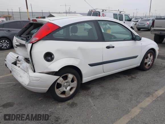 ✅ 2003 Ford Focus ZX3 • VIN: 3FAFP31Z23R147547 • Lot: 42426117. Listed on IAAI with 129,860 mi. Free auction sales archive from the USA and detailed vehicle history report at DreamBid. Image 4.