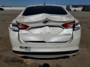 ✅ 2013 Ford Fusion Titanium Hybrid • VIN: 3FA6P0RU3DR291973 • Лот: 82748155. Опубликован ранее на Copart с пробегом Не указан. Бесплатный доступ к архиву аукционных продаж из США и подробный отчёт об истории автомобиля на DreamBid. Изображение 6.