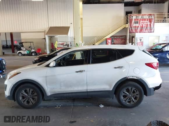 2015 Hyundai Santa Fe z VIN 5XYZTDLB4FG294735, wystawiony jako IAAI lot #43230960 z przebiegiem 169 342 mil mil oraz . Historia ofert i sprzedaży dostępna na DreamBid. Obrazek 15.