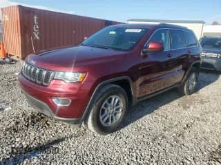 2018 Jeep Grand Cherokee Laredo E with VIN 1C4RJEAG1JC131077, listed as a Copart auction lot 82291615 with 100,413 mi miles and Clean title. Bid and sale history available at DreamBid. Image 1.