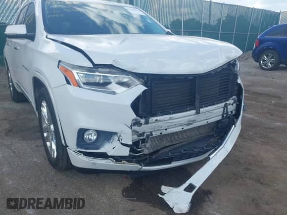 2018 Chevrolet Traverse High Country z VIN 1GNEVKKW3JJ107938, wystawiony jako IAAI lot #43356811 z przebiegiem 76 017 mil mil oraz . Historia ofert i sprzedaży dostępna na DreamBid. Obrazek 6.