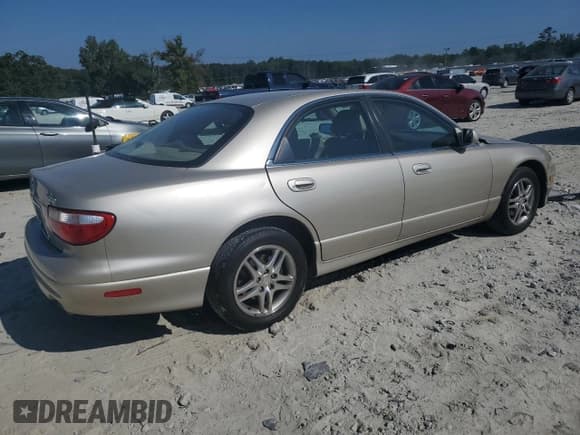 ✅ 1999 Mazda Millenia • VIN: JM1TA2217X1502746 • Lot: 72165894. Listed on Copart with 196,957 mi. Free auction sales archive from the USA and detailed vehicle history report at DreamBid. Image 3.