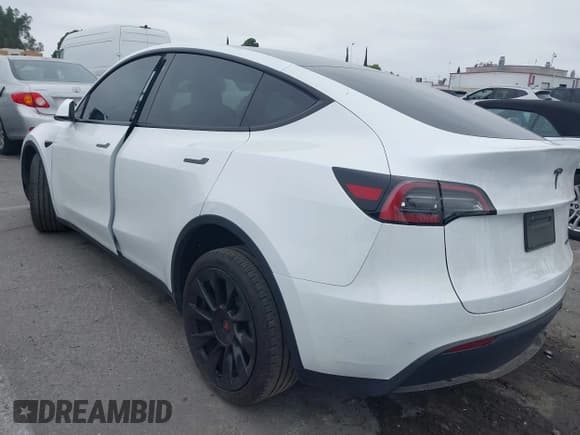 ✅ 2023 Tesla Model Y Long Range • VIN: 7SAYGDEE3PA055497 • Lot: 42396529. Listed on IAAI with 18,230 mi. Free auction sales archive from the USA and detailed vehicle history report at DreamBid. Image 3.
