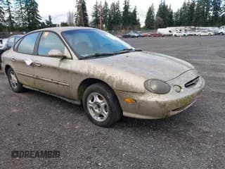 ✅ 1998 Ford Taurus LX • VIN: 1FAFP52U7WG250604 • Лот: 43798964. Опубликован ранее на IAAI с пробегом 142 648 миль. Бесплатный доступ к архиву аукционных продаж из США и подробный отчёт об истории автомобиля на DreamBid. Изображение 1.
