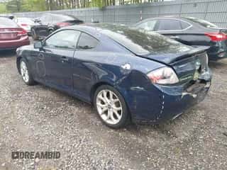 2008 Hyundai Tiburon GT z VIN KMHHN66F98U281833, wystawiony jako IAAI lot #42242717 z przebiegiem 123 291 mil mil oraz . Historia ofert i sprzedaży dostępna na DreamBid. Obrazek 3.