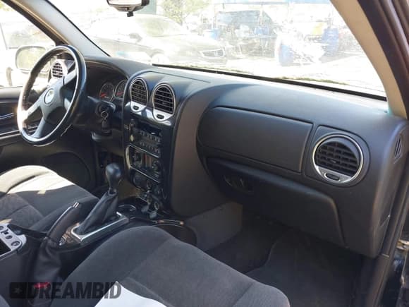 ✅ 2005 GMC Envoy SLE • VIN: 1GKDT13S452198027 • Lot: 42243258. Listed on IAAI with 144,240 mi. Free auction sales archive from the USA and detailed vehicle history report at DreamBid. Image 5.