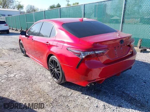 2021 Toyota Camry Hybrid XSE with VIN 4T1K31AK6MU030152, listed as a IAAI auction lot 41878099 with 81,333 mi miles and . Bid and sale history available at DreamBid. Image 3.