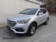 ✅ 2018 Hyundai Santa Fe 2.4L • VIN: 5XYZT3LB6JG565927 • Лот: 92522215. Опубликован ранее на Copart с пробегом 116 009 миль. Бесплатный доступ к архиву аукционных продаж из США и подробный отчёт об истории автомобиля на DreamBid. Изображение 2.