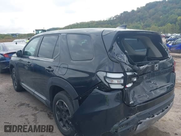 ✅ 2023 Honda Pilot EX-L • VIN: 5FNYG1H41PB045908 • Lot: 43286559. Listed on IAAI with 32,146 mi. Free auction sales archive from the USA and detailed vehicle history report at DreamBid. Image 3.