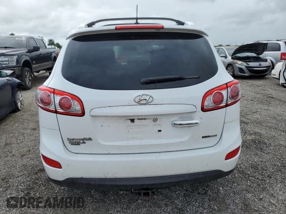 ✅ 2012 Hyundai Santa Fe Limited • VIN: 5XYZKDAG1CG143185 • Lot: 74531934. Listed on Copart with 186,312 mi. Free auction sales archive from the USA and detailed vehicle history report at DreamBid. Image 6.