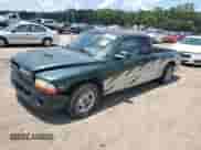 1999 Dodge Dakota SLT z VIN 1B7GL22X0XS145128, wystawiony jako Copart lot #64959364 z przebiegiem 96 047 mil mil oraz Szkoda całkowita • Salvage title. Historia ofert i sprzedaży dostępna na DreamBid. Obrazek 1.