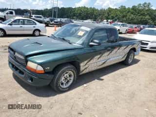 1999 Dodge Dakota SLT z VIN 1B7GL22X0XS145128, wystawiony jako Copart lot #64959364 z przebiegiem 96 047 mil mil oraz Szkoda całkowita • Salvage title. Historia ofert i sprzedaży dostępna na DreamBid. Obrazek 1.