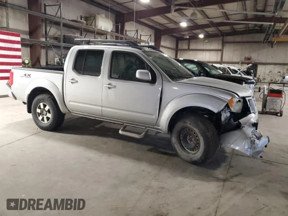 ✅ 2012 Nissan Frontier Pro-4X • VIN: 1N6AD0EV5CC433617 • Lot: 70911255. Listed on Copart with 86,268 mi. Free auction sales archive from the USA and detailed vehicle history report at DreamBid. Image 4.