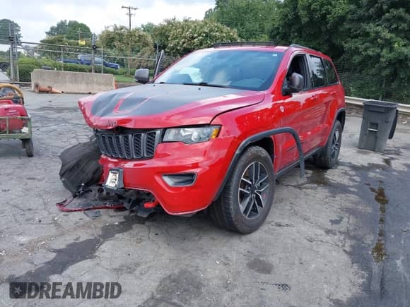 2021 Jeep Grand Cherokee Trailhawk with VIN 1C4RJFLGXMC579888, listed as a IAAI auction lot 42951354 with 76,948 mi miles and . Bid and sale history available at DreamBid. Image 2.