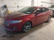 ✅ 2015 Ford Fusion Titanium • VIN: 3FA6P0D90FR287451 • Лот: 43780577. Опубликован ранее на IAAI с пробегом 162 309 миль. Бесплатный доступ к архиву аукционных продаж из США и подробный отчёт об истории автомобиля на DreamBid. Изображение 2.