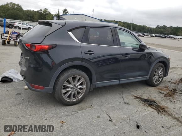 ✅ 2019 Mazda CX-5 Grand Touring • VIN: JM3KFBDM9K0549030 • Лот: 82774585. Опубликован ранее на Copart с пробегом 74 307 миль. Бесплатный доступ к архиву аукционных продаж из США и подробный отчёт об истории автомобиля на DreamBid. Изображение 3.