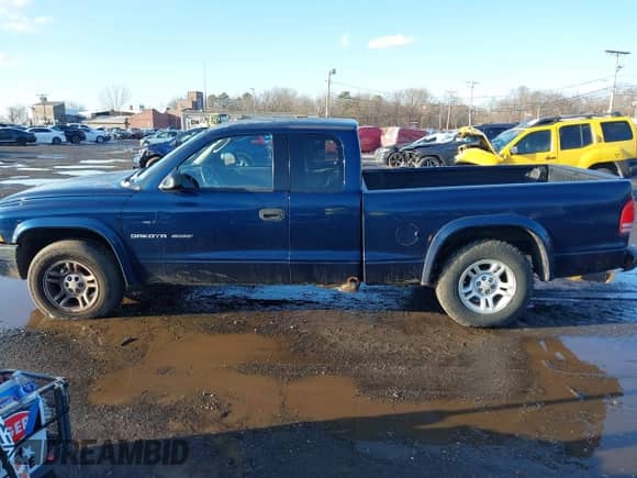 2002 Dodge Dakota Sport z VIN 1B7GL32X52S569340, wystawiony jako IAAI lot #41541480 z przebiegiem 176 632 mil mil oraz . Historia ofert i sprzedaży dostępna na DreamBid. Obrazek 14.