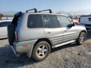✅ 2000 Toyota RAV4 • VIN: JT3GP10V0Y7066258 • Лот: 72776334. Опубликован ранее на Copart с пробегом 228 243 миль. Бесплатный доступ к архиву аукционных продаж из США и подробный отчёт об истории автомобиля на DreamBid. Изображение 3.