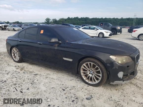 ✅ 2013 BMW 7 Series 750i • VIN: WBAYA8C58DC996414 • Lot: 62928835. Listed on Copart with 174,807 mi. Free auction sales archive from the USA and detailed vehicle history report at DreamBid. Image 4.