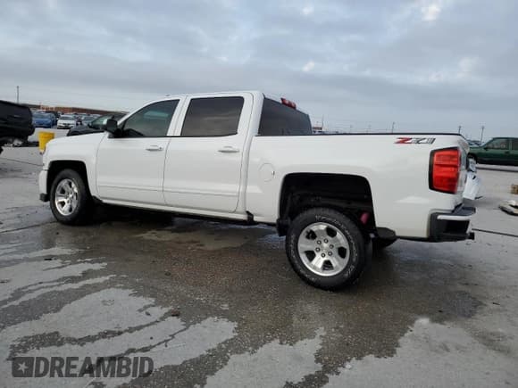 ✅ 2018 Chevrolet Silverado 1500 LT • VIN: 3GCUKREC3JG549983 • Lot: 89824365. Listed on Copart with 74,697 mi. Free auction sales archive from the USA and detailed vehicle history report at DreamBid. Image 2.