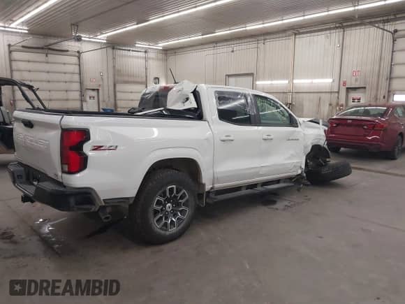 2025 Chevrolet Colorado 4WD Z71 with VIN 1GCPTDEK3S1121299, listed as a IAAI auction lot 43455862 with 2,148 mi miles and . Bid and sale history available at DreamBid. Image 4.