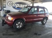 ✅ 2001 Kia Sportage • VIN: KNDJA723915704459 • Lot: 61231055. Wystawiony na Copart z przebiegiem 81 905 mil. Bezpłatny archiwum sprzedaży aukcyjnych z USA i szczegółowy raport historii pojazdu na DreamBid. Zdjęcie 1.