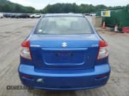 ✅ 2013 Suzuki SX4 LE • VIN: JS2YC5A30D6102522 • Lot: 62997455. Wystawiony na Copart z przebiegiem 73 720 mil. Bezpłatny archiwum sprzedaży aukcyjnych z USA i szczegółowy raport historii pojazdu na DreamBid. Zdjęcie 6.