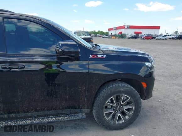 2022 Chevrolet Tahoe Z71 z VIN 1GNSKPKD2NR174478, wystawiony jako IAAI lot #42016813 z przebiegiem 71 801 mil mil oraz . Historia ofert i sprzedaży dostępna na DreamBid. Obrazek 15.