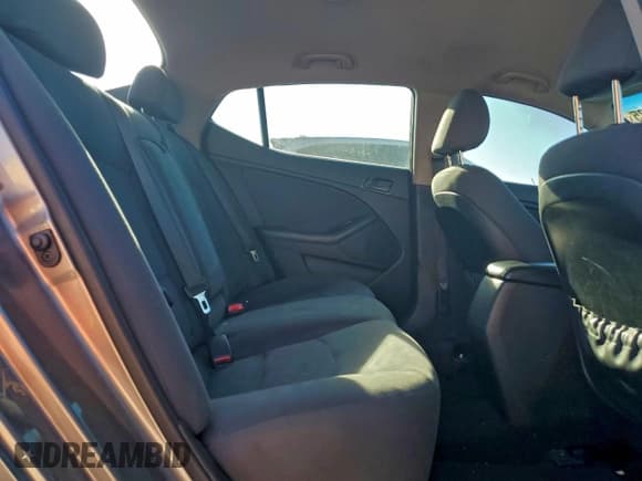 ✅ 2015 Kia Optima LX • VIN: 5XXGM4A77FG466439 • Lot: 94572025. Listed on Copart with 128,472 mi. Free auction sales archive from the USA and detailed vehicle history report at DreamBid. Image 10.