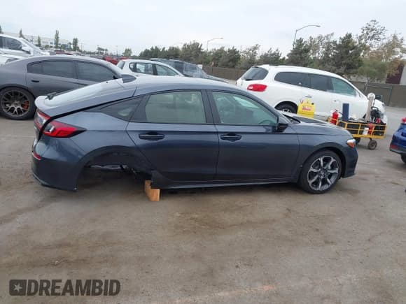 ✅ 2025 Honda Civic Sport Touring • VIN: JHMFL4H91SX003848 • Lot: 43075678. Listed on IAAI with 1,885 mi. Free auction sales archive from the USA and detailed vehicle history report at DreamBid. Image 14.