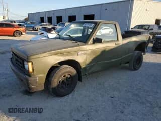 1990 Chevrolet S-10 с VIN 1GCCS14E0L2143381, выставлен на аукционе Copart как лот 88086495 с пробегом 98 559 миль миль и Списание • Salvage title. История ставок и продаж доступна на DreamBid. Изображение 1.