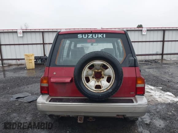 ✅ 1996 Suzuki Sidekick • VIN: JS3TD21V0T4107927 • Lot: 41249522. Listed on IAAI with 225,665 mi. Free auction sales archive from the USA and detailed vehicle history report at DreamBid. Image 16.