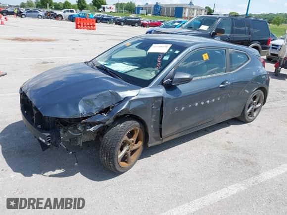 2019 Hyundai Veloster Premium z VIN KMHTG6AF2KU016593, wystawiony jako IAAI lot #42310151 z przebiegiem Nie podano mil oraz . Historia ofert i sprzedaży dostępna na DreamBid. Obrazek 20.