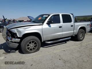 ✅ 2004 Dodge Dakota SLT • VIN: 1D7HG48N74S509797 • Lot: 57797055. Wystawiony na Copart z przebiegiem 214 275 mil. Bezpłatny archiwum sprzedaży aukcyjnych z USA i szczegółowy raport historii pojazdu na DreamBid. Zdjęcie 1.