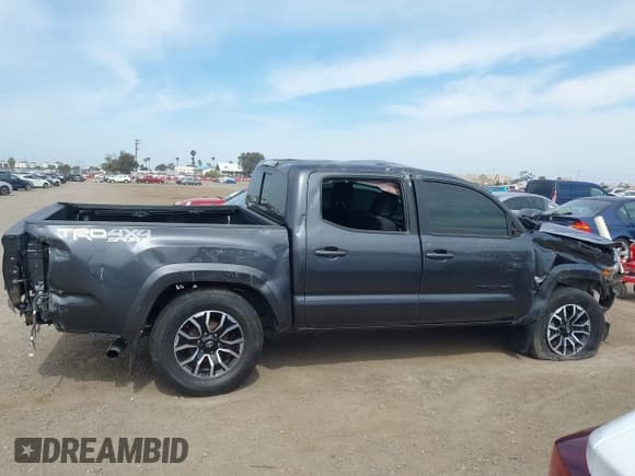 ✅ 2023 Toyota Tacoma SR • VIN: 3TMCZ5AN6PM618750 • Lot: 42239475. Listed on IAAI with 34,719 mi. Free auction sales archive from the USA and detailed vehicle history report at DreamBid. Image 12.