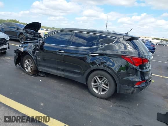 2018 Hyundai Santa Fe 2.4L z VIN 5XYZT3LB3JG541357, wystawiony jako IAAI lot #43481395 z przebiegiem 99 707 mil mil oraz . Historia ofert i sprzedaży dostępna na DreamBid. Obrazek 3.