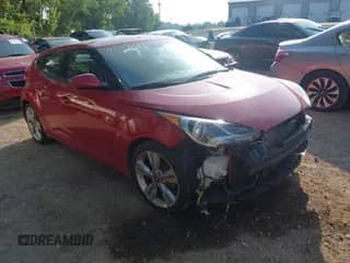 2016 Hyundai Veloster z VIN KMHTC6AD0GU264343, wystawiony jako IAAI lot #42531011 z przebiegiem 105 607 mil mil oraz . Historia ofert i sprzedaży dostępna na DreamBid. Obrazek 1.