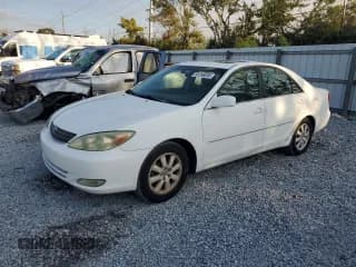 ✅ 2004 Toyota Camry LE • VIN: 4T1BE32K34U310924 • Lot: 93256895. Listed on Copart with 83,712 mi. Free auction sales archive from the USA and detailed vehicle history report at DreamBid. Image 1.