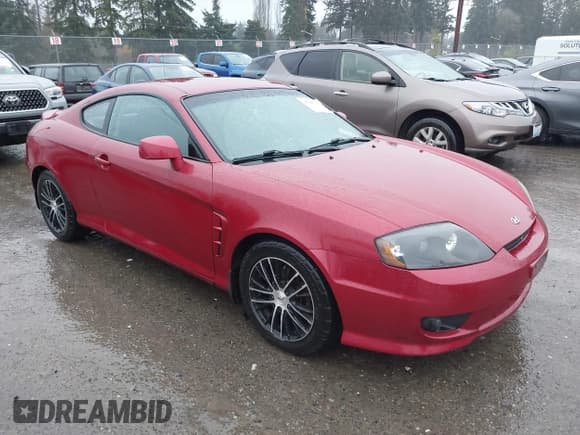 ✅ 2006 Hyundai Tiburon GS • VIN: KMHHM65D06U194001 • Лот: 43849075. Опубликован ранее на IAAI с пробегом 246 283 миль. Бесплатный доступ к архиву аукционных продаж из США и подробный отчёт об истории автомобиля на DreamBid. Изображение 1.